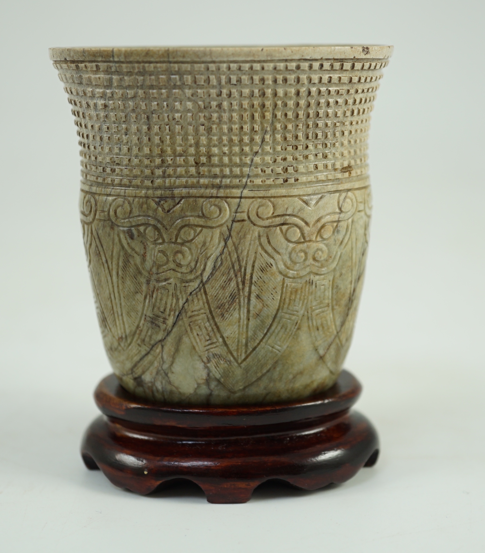 A Chinese archaistic burnt ‘chicken bone’ jade oval cup, chan, probably Song dynasty, 7.1 cm high, small chip repair